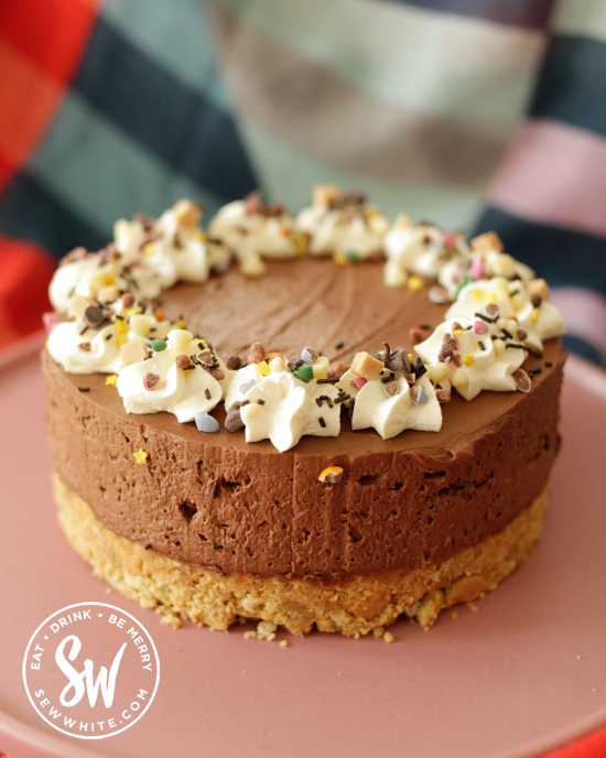 Chocolate Guinness cheesecake  decorated with sprinkles for the St Patrick's Day