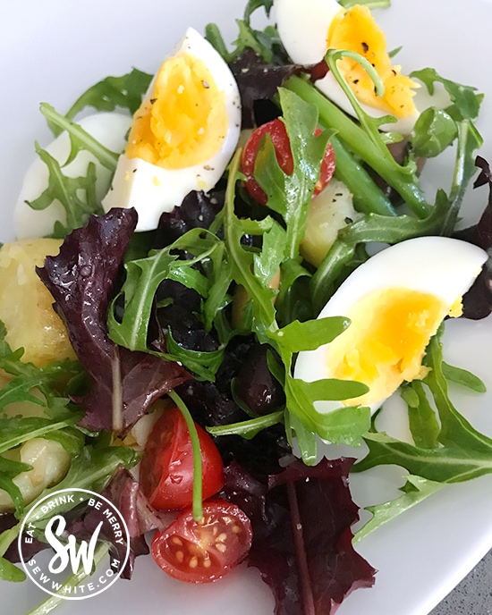 boiled egg salad with green beans, new potatoes, tomatoes and green and purple baby leaf salad , easy egg salad.