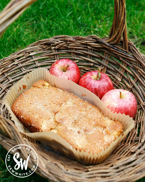 apple ginger cake in a wicker basket with fresh apples