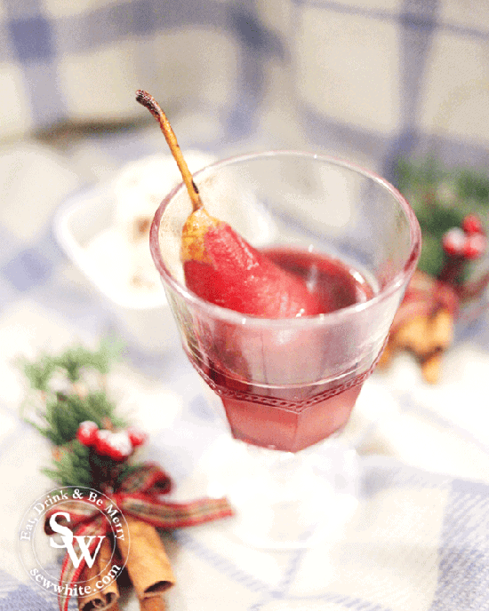 mulled wine cooked pears served in a wine glass