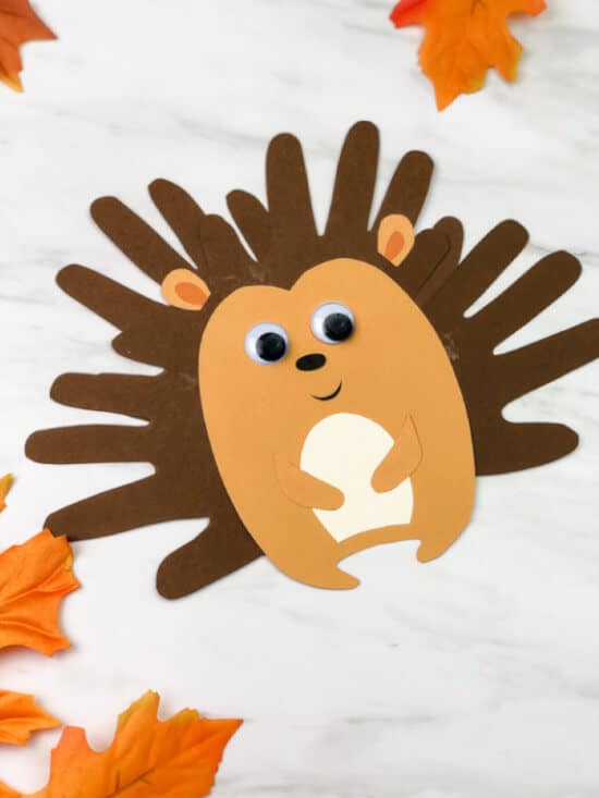 handprint hedgehog in dark and light brown colored paper craft