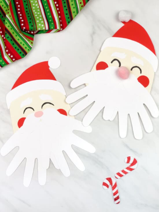 Christmas cards made with handprint featuring Santa