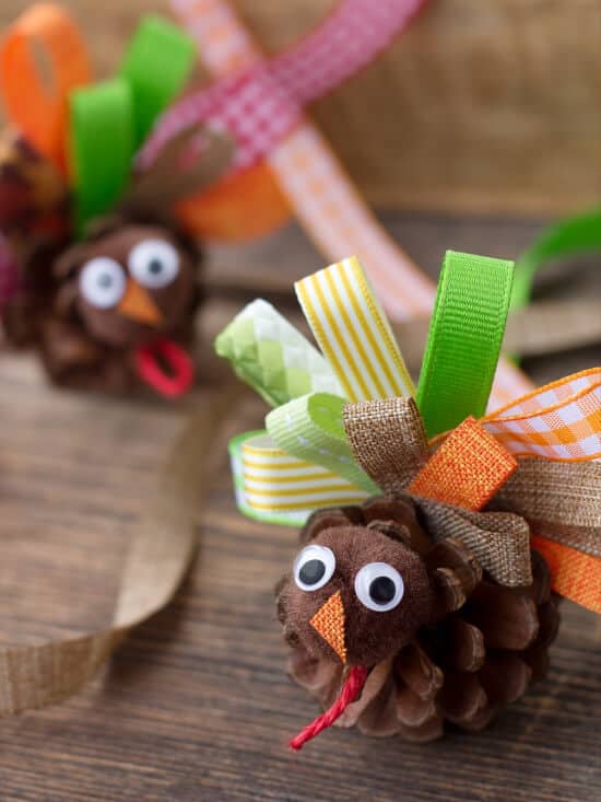 turkey craft made with pine cones and fabric for thanksgiving