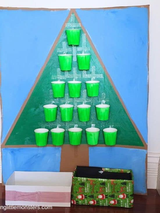drop a ball into the cup on the christmas tree game