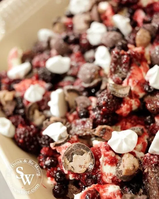 Glistening red berries, truffles and meringues making up the Black Forest Truffle Eton Mess