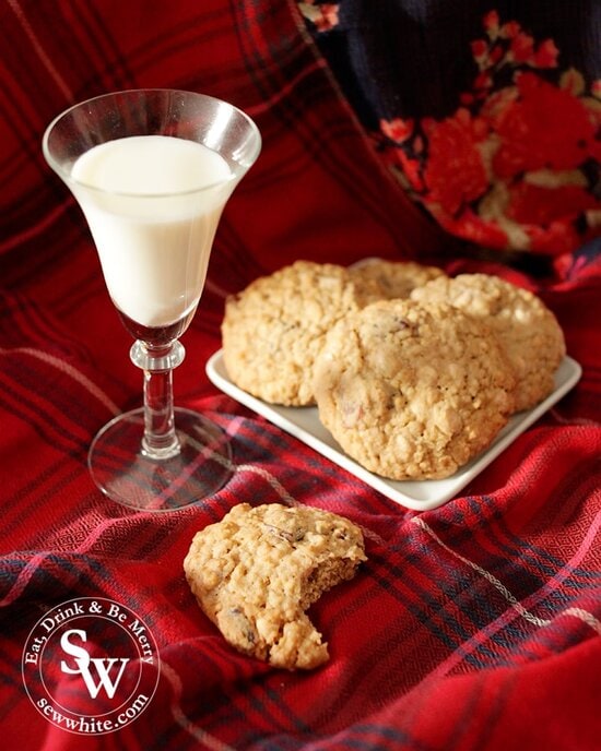 Cranberry and White Chocolate Cookies on a red tartan with a glass of milk