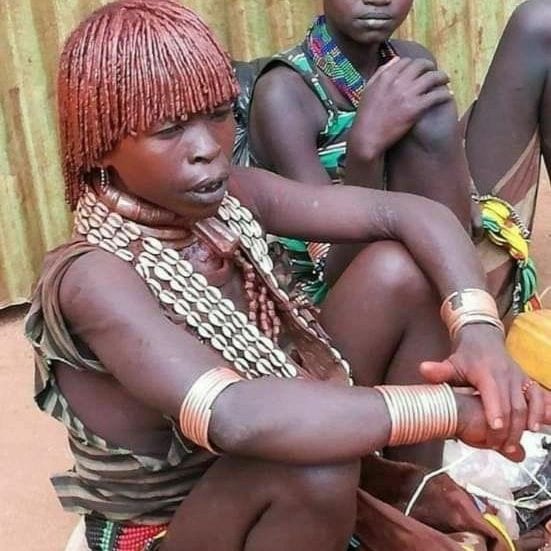 Hamar woman in Omo Valley adorned with beads and ochre – celebrating cultural pride