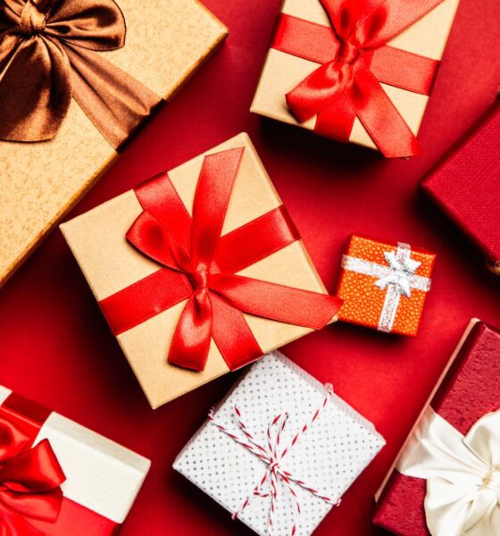 assorted gift boxes on red surface