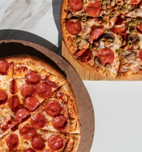 pizza on brown wooden tray