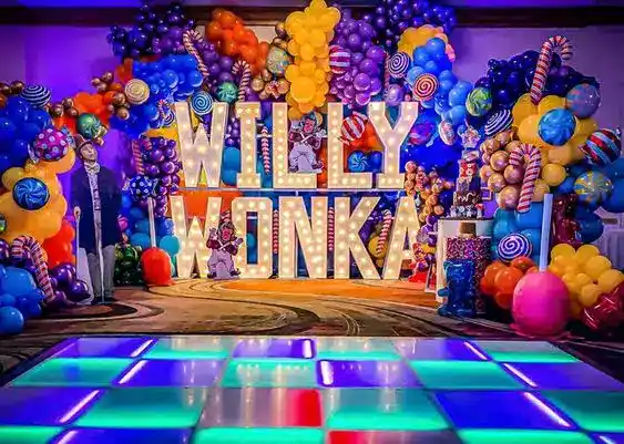 Colorful Willy Wonka themed balloon display with vibrant colors and whimsical design. Perfect for pa.