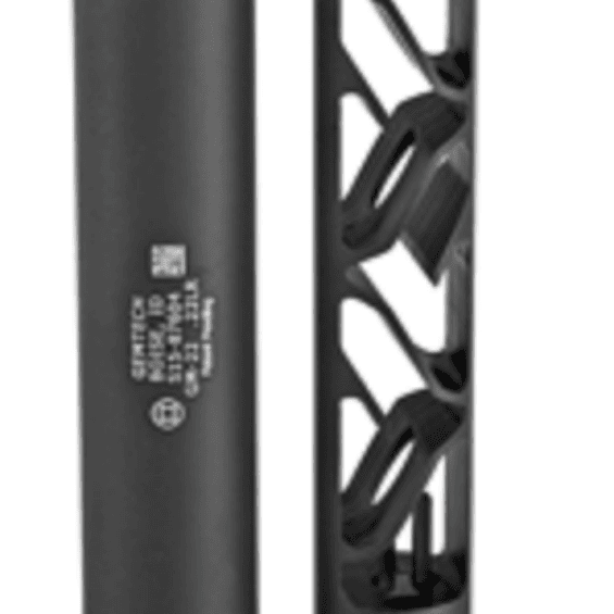 Two black cylindrical parts, a solid tube on the left and a lattice-framed cartridge on the right.