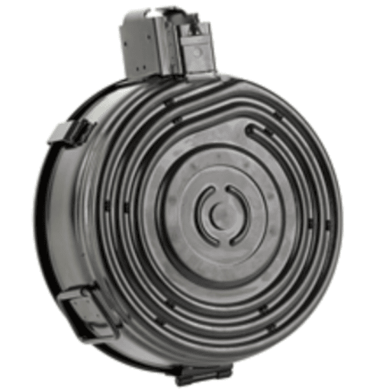 Large round metal flywheel with concentric grooves and a sensor housing mounted on top.