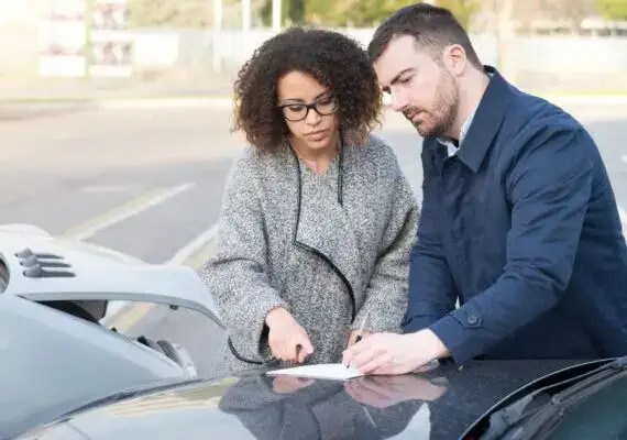 Texas driver reviewing car insurance policy coverage in Houston, considering liability and uninsured motorist protection.
