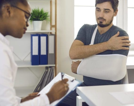 Houston injury lawyer reviewing documents with accident victim