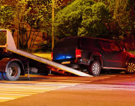 Houston car accident victim having his car towed after a collision.