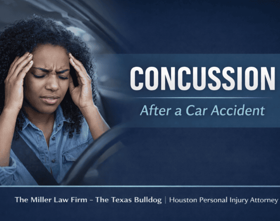 Woman experiencing concussion symptoms after a car accident while holding her head in pain inside a vehicle