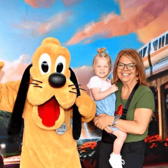 Cute family enjoying a Disney theme park with character meet and greet for perfect Orlando vacation memories.