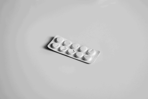white blister pack of medicine on a white surface