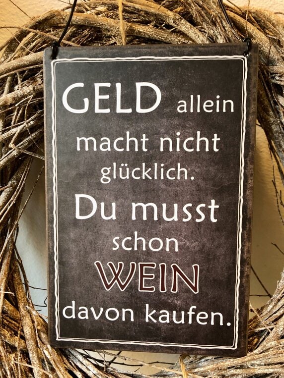 Schild Geld allein macht nicht glücklich