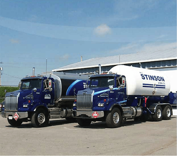 An image featuring two Stinson fuel delivery trucks