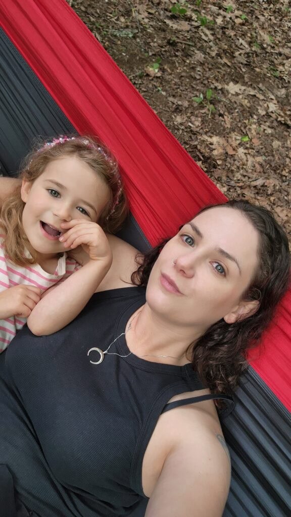 Phoenyx and River relaxing on a hammock while camping at Julian Price Campground in Blowing Rock, North Carolina.
