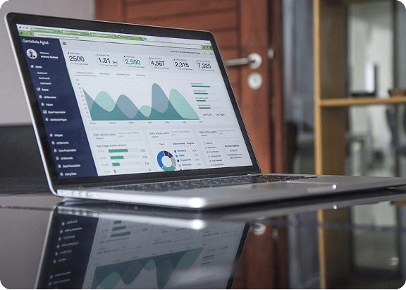 Analytics dashboard displaying data charts and metrics on a laptop screen.
