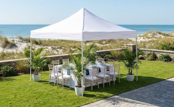 Festive party decor setup in Myrtle Beach featuring a pennant banner and string lights for an outdoor celebration.