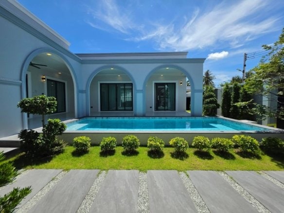 Modern luxury house with swimming pool and arched windows