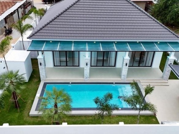 Aerial view modern white house turquoise pool palm trees