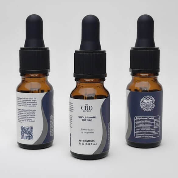 Three amber dropper bottles of The CBD Expert's CBD Whole-Flower Fluid against a white background