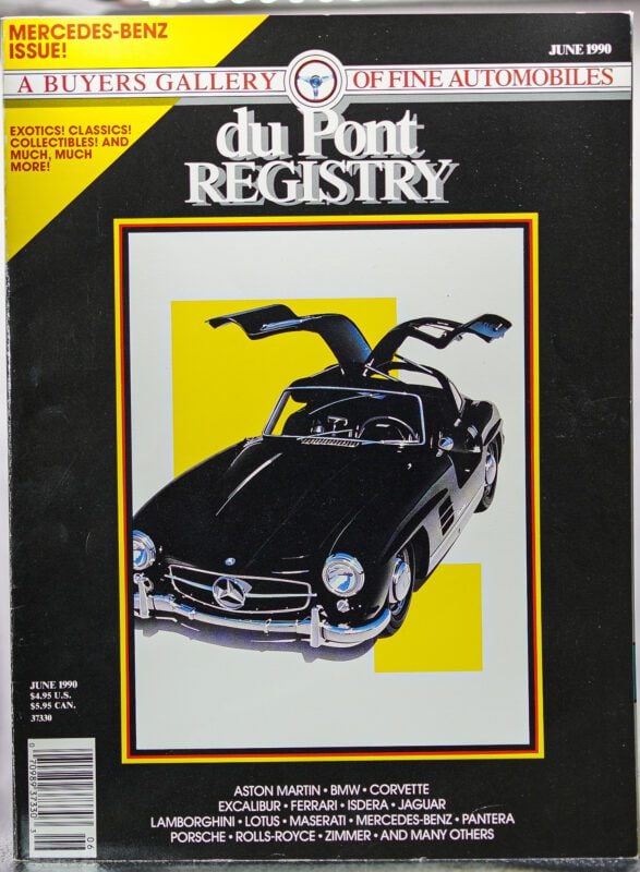 June 1990 duPont REGISTRY Cover Cars edition featuring a black classic Mercedes-Benz with gullwing doors open, set in a yellow frame with automotive brand names below—celebrating the 40th Anniversary of this iconic vehicle.