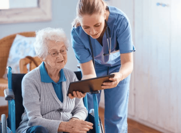 Caregiver supporting a senior client at home during a training session?