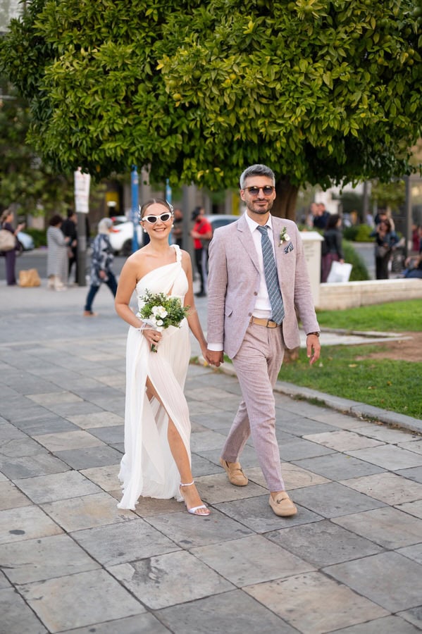 Stylish bride and groom in Athens architecture