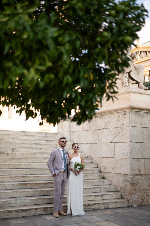 Stylish bride and groom in Athens architecture