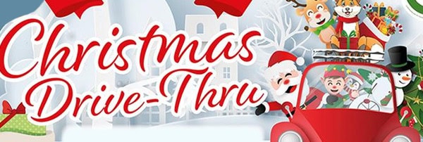 Festive holiday drive-thru event with Christmas decorations and cheerful characters.