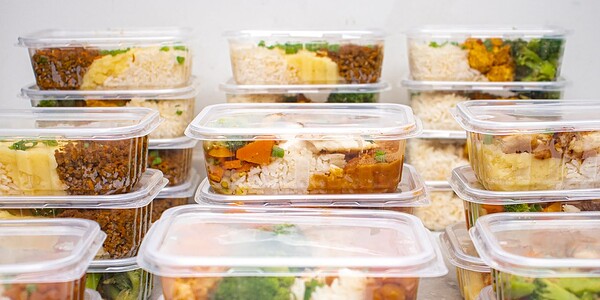 Multiple containers of prepared meals with rice and vegetables for easy meal management.