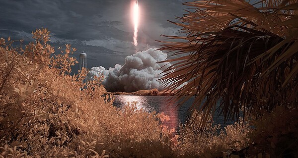Rocket launch rising into the sky from Cape Canaveral