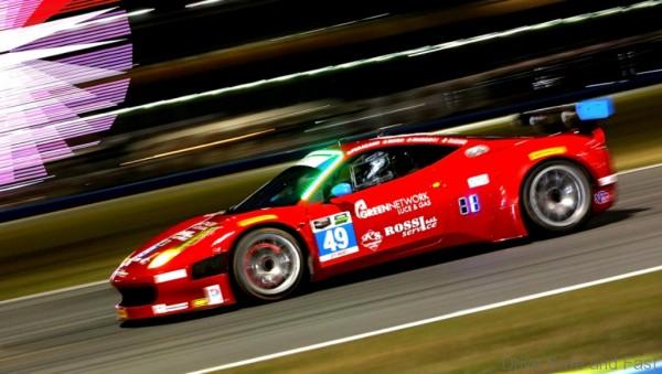 DAYTONA BEACH, FL - JANUARY 23:  The #49 Spirit of Race Ferrarri 458 Italia driven by Piergiuseppe Peerazzini, Gialuca Roda, Paolo Ruberti and David Rigon during night practice for the Rolex 24 at Daytona International Speedway on January 23, 2014 in Daytona Beach, Florida.  (Photo by Jerry Markland/Getty Images)
