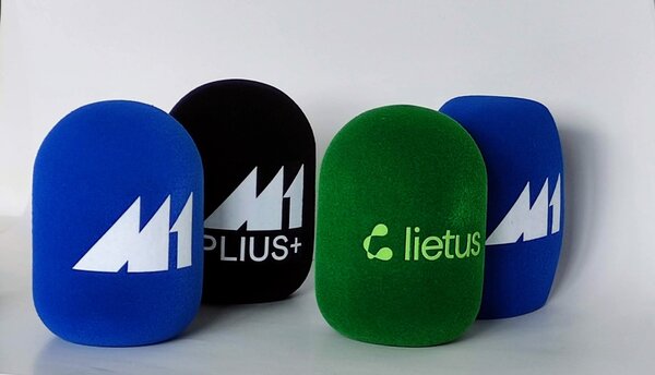 Set of branded foam microphone windscreens in blue, black, and green with printed logos, broadcast mic covers for radio and TV.