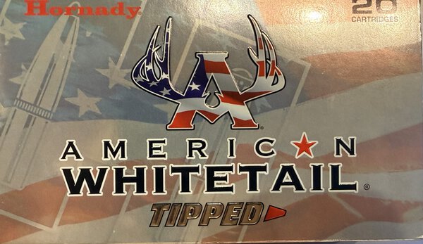 Close-up of a Hornady American Whitetail ammunition box showing the patriotic logo and bold 'AMERICAN WHITETAIL' lettering.