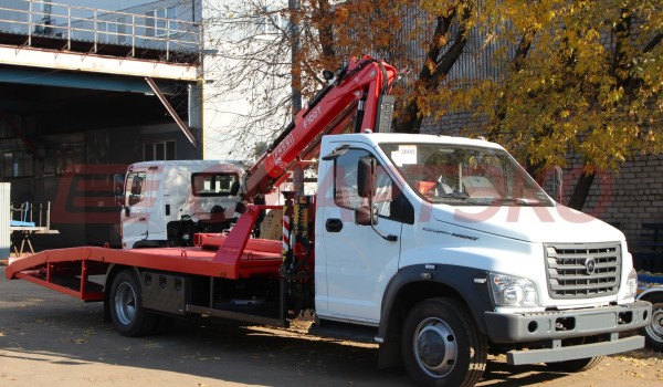 Эвакуатор ГАЗ ГАЗон Next с ломаной платформой и КМУ Fassi F100T