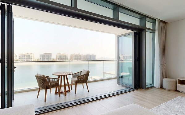 Fold and slide doors on an Al Reem Island apartment balcony