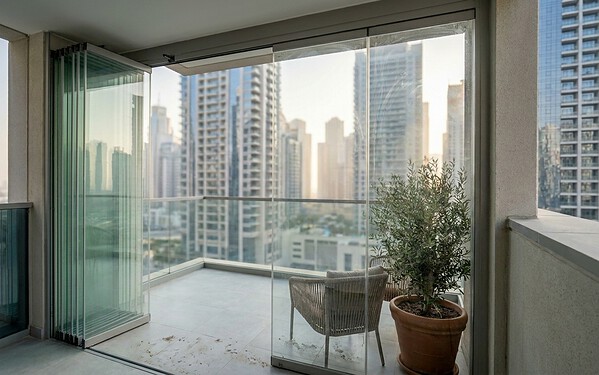 Bi-fold doors stacked open on a Marina penthouse terrace