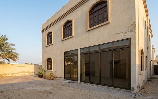 Canal-front sliding doors at an Al Raha Beach home in Abu Dhabi