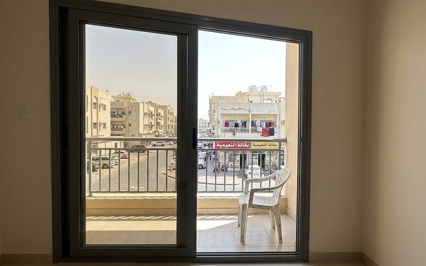 Wide lift-and-slide garden doors at a Khalifa City villa in Abu Dhabi