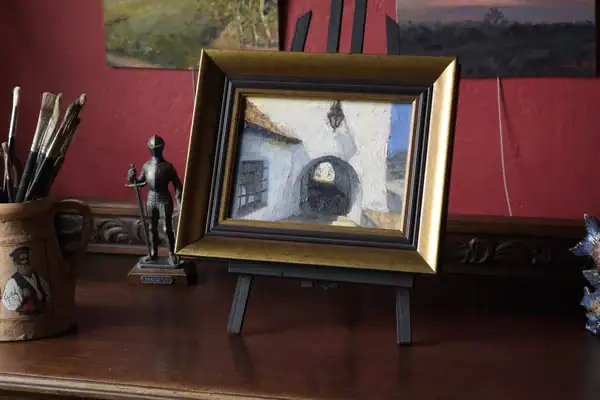 Framed Kazimierskie Podcienie architecture painting displayed in Andrea Bocedi’s studio