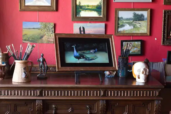 Pavoni original peacock oil painting from Monza displayed in a studio interior