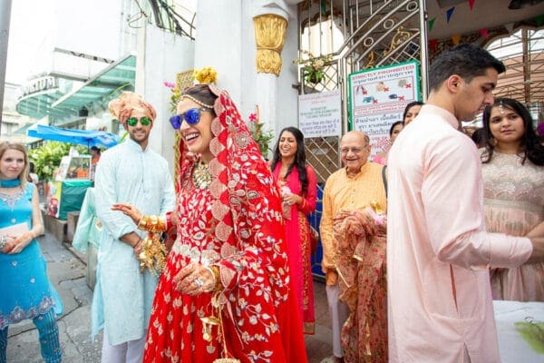 Bride surrounded by family and friends at her Doli