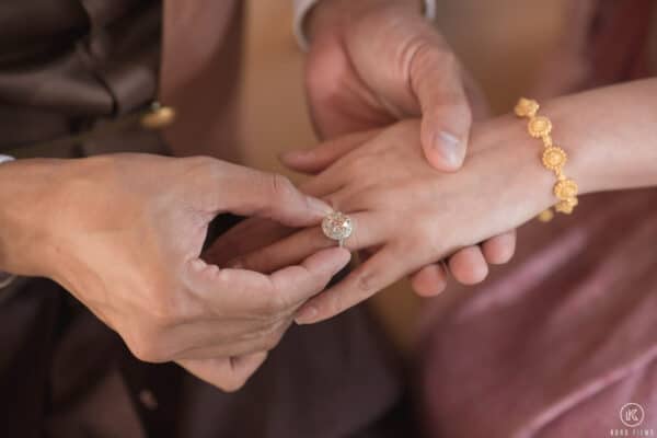 Close-up of the engagement ring and the bride's gold bracelet at a Thai ceremony at Dusit Thani Hua Hin