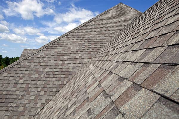 Long side view of a beautiful tan colored shingle roof in Florida.
